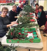  ?? Pomperaug Valley Garden Club / Contribute­d photo ?? Members’ wreath making event, pre-COVID.