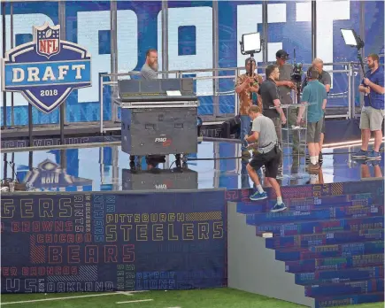  ?? TNS VIA GETTY IMAGES ?? The 2018 NFL Draft Theater is built on the field of AT&T Stadium in Arlington, Texas, on Tuesday.