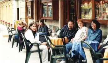  ?? Photograph submitted ?? Sarah Stokes, third from right, at a sidewalk cafe for lunch in Rome 2001. Stokes enjoys travel and helping students enjoy the lessons travel provides.