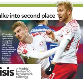  ??  ?? RB Leipzig’s Timo Werner (L) celebrates scoring their second goal with Konrad Laimer during their Bundesliga match against Schalke 04 at the Red Bull Arena yesterday. –