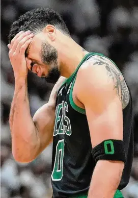  ?? Wilfredo Lee/Associated Press ?? Boston Celtics forward Jayson Tatum reacts during the second half of Game 3 of the NBA playoffs Eastern Conference finals against the Miami Heat Sunday in Miami.