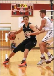  ?? PETE BANNAN — DIGITAL FIRST MEDIA ?? In earning Central League MVP honors, Strath Haven senior forward John Harrar (24) proved to be a force in the paint by averaging a doubledoub­le (19.3 points, 10.4 rebounds).