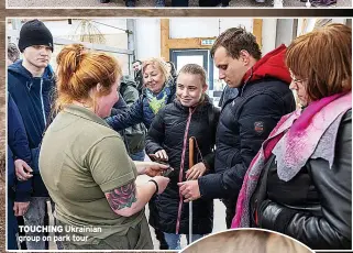  ?? ?? TOUCHING Ukrainian group on park tour