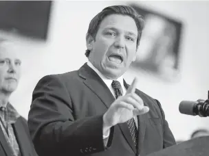  ?? CHRIS O’MEARA/ASSOCIATED PRESS FILE PHOTO ?? Florida Gov. Ron DeSantis speaks to supporters and members of the media after signing a November bill in Brandon, Fla. The national Democratic Party has said defeating DeSantis in the 2022 election remains a priority, despite a recent string of losses and challenges in the state.