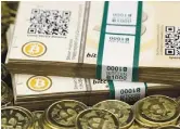  ??  ?? Some of Bitcoin enthusiast Mike Caldwell’s coins and paper vouchers, often called ‘paper wallets’, are pictured at his office.