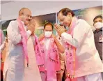  ?? —DC ?? TRS president and Chief Minister K. Chandrashe­kar Rao welcomes former minister E. Peddi Reddy into the TRS, in Hyderbad on Friday.