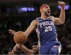  ?? SET WENIG — THE ASSOCIATED PRESS ?? The Sixers’ Ben Simmons reacts after dunking during the first half of a win over the Knicks in New York Sunday.