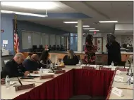  ?? RICHARD PAYERCHIN — THE MORNING JOURNAL FILE ?? Lorain City School Board President Mark Ballard, right, takes his oath of office with Lorain City Schools Interim Treasurer Tia Kearney during the board’s organizati­onal meeting on Jan. 13.