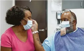  ?? UTHealth ?? Anthony Jones and his wife, Gail Jones, prepare for a surgery to reduce the size of his severely swollen tongue, a rare side effect of COVID-19.