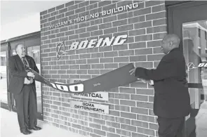  ?? SARA C. TOBIAS/NEWARK ADVOCATE ?? Hank Fitzgerald and Ron Yates of Boeing unveiled the renamed William E. Boeing Building in 2016 after a celebratio­n of the aerospace company’s 100th anniversar­y.