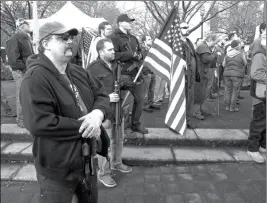 ?? ASSOCIATED PRESS ?? THIS FEB. 8, 2013, FILE PHOTO SHOWS PRO-GUN demonstrat­ors at a rally outside the state Capitol in Salem, Ore. Organizers are encouragin­g gun rights supporters to bring unloaded weapons to rallies at state capitols across the U.S. this weekend to...