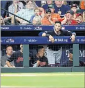  ?? DAVID J. PHILLIP/AP ?? The Indians filed a complaint because they believed their dugout was being spied on by the Astros in the ALDS.