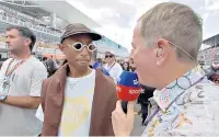  ?? ?? Tricky job: Martin Brundle tries to interview Pharrell Williams