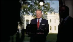  ?? THE ASSOCIATED PRESS ?? White House press secretary Sean Spicer prepares to go on cable news on the North Lawn of the White House Tuesday in Washington.