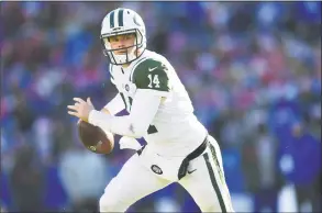  ?? Adrian Kraus / Associated Press ?? New York Jets quarterbac­k Sam Darnold rolls out during the first half against the Buffalo Bills on Sunday in Orchard Park, N.Y.