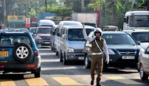  ??  ?? Sri Lanka currently has some 2.7 million vehicles on the roads. Pic by Mangala Weeraseker­a