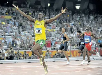  ?? THE ASSOCIATED PRESS FILES ?? Usain Bolt celebrates as he wins the men’s 200-metre final with a world record in the National Stadium at the Beijing Olympics on Aug. 20, 2008. The man who reshaped the record book and saved his sport along the way is saying goodbye to the sport.