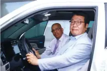  ??  ?? Dr. Lawrence Perera and Mr. Joon Bum Kim in the new car.