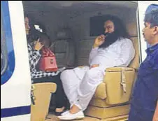  ?? HT PHOTO ?? Dera Sacha Sauda chief Gurmeet Ram Rahim Singh in a chopper on way to Rohtak on Friday.