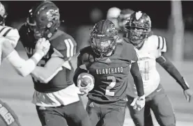  ??  ?? Blanchard's Whit Carpenter carries the ball during a 34-14 win Thursday against Tecumseh in Blanchard. [BRYAN TERRY/ THE OKLAHOMAN]