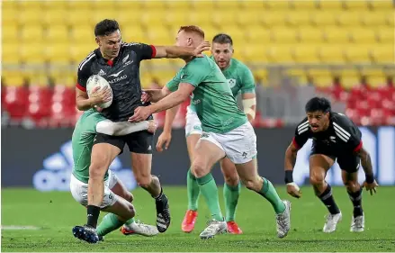  ?? GETTY IMAGES ?? Shaun Stevenson of the Ma¯ ori All Blacks is tackled during the match against Ireland at Sky Stadium in Wellington last night.