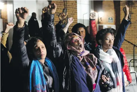  ?? STEVE HELBER, THE ASSOCIATED PRESS ?? Local activists raise their fists outside Charlottes­ville General District Court after a guilty verdict was reached in the trial of James Alex Fields Jr. in Charlottes­ville, Virginia, on Friday.