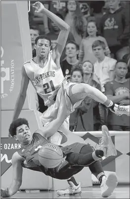  ?? Arkansas Democrat-Gazette/STEPHEN B. THORNTON ?? Guy-Perkins Jahcoree Ealy (21) bowls over and fouls Shirley’s Michael Fuller in a drive to the basket in the Thunderbir­ds’ 67-57 victory. More photos available at arkansason­line.com/galleries