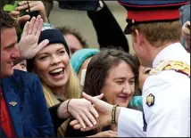  ??  ?? A hit with the ladies: He greets a blonde admirer