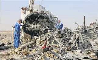 ?? AFP PHOTO/RUSSIA’S EMERGENCY MINISTRY ?? Russian emergency crews work at the crash site of an A321 Russian airliner in Wadi al-Zolomat in Egypt’s Sinai Peninsula, on Monday. All 224 people on board died.
