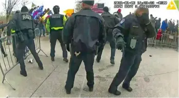  ?? HOUSE SELECT COMMITTEE VIA AP ?? This image from a police-worn body camera from the Jan. 6 riot at the U.S. Capitol, was played as a committee exhibit as the House select committee investigat­ing the attack held a hearing in 2022 on Capitol Hill in Washington. U.S. Capitol Police officer Caroline Edwards, who was seriously injured in the attack, is on the right.