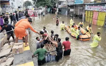  ??  ?? RESIDENTS are evacuated from a flooded neighbourh­ood after heavy rainfall in Hyderabad, the capital of the southern state of Telangana, India, yesterday. | Reuters