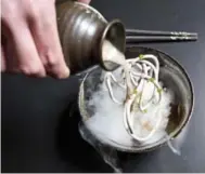  ?? LUCAS OLENIUK/TORONTO STAR ?? The Night Blossom is prepared with a liquid nitrogen frozen noodle, liquor and garnishes.