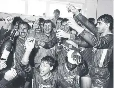  ?? ?? Players celebrate promotion with manager Neil Warnock in May 1987.