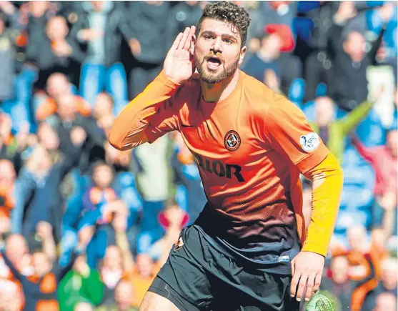  ?? SNS. ?? Nadir Ciftci cups his hand to his ear as he celebrates scoring United’s third goal in a Scottish Cup semi-final win over Rangers in 2014.