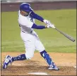  ?? ASHLEY LANDIS — THE ASSOCIATED PRESS ?? Los Angeles Dodgers’ Mookie Betts flies out to right field during the third inning of Friday’s game in Los Angeles.