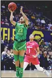  ??  ?? Oregon’s Minyon Moore (left), shoots past California’s Leilani McIntosh (1) in the first half of an NCAA college basketball game on Feb 21 in Berkeley, California. (AP)