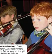  ??  ?? Concentrat­ion Fraser Cronin, Callander Primary, and Arthur Jacques, a pupil at St Ninians Primary