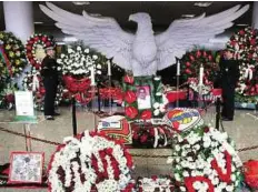  ??  ?? Floral tributes The coffin of late Portuguese legend Eusebio lies in state at Portuguese club Benfica’s Luz Stadium.