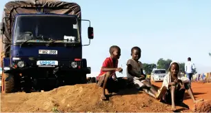  ??  ?? Children displaced by war in South Sudan play by a UN High Commission­er for Refugees truck at the Palabek Refugee Settlement Camp in Lamwo district, Uganda, recently. (Reuters)