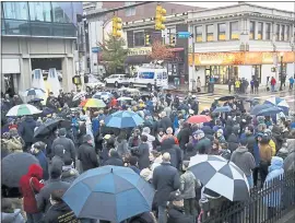  ?? MATT ROURKE — THE ASSOCIATED PRESS ?? People gather for a vigil Saturday night honoring the victims of a deadly mass shooting at the Tree of Life Synagogue in the Squirrel Hill neighborho­od of Pittsburgh.