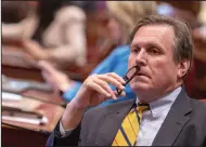  ?? (AP/Rich Pedroncell­i) ?? State Sen. Scott Wilk, R-Santa Clarita, listens as members speak on a bill to reduce the state budget deficit at the Capitol in Sacramento, Calif., on Thursday. Gov. Gavin Newsom has said the deficit is about $38 billion.