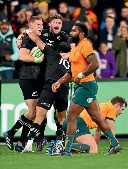  ?? GETTY IMAGES ?? Jordie Barrett, left, sparks jubilant scenes when his late try seals a come-from-behind win for the All Blacks over the Wallabies in Melbourne on Thursday night.