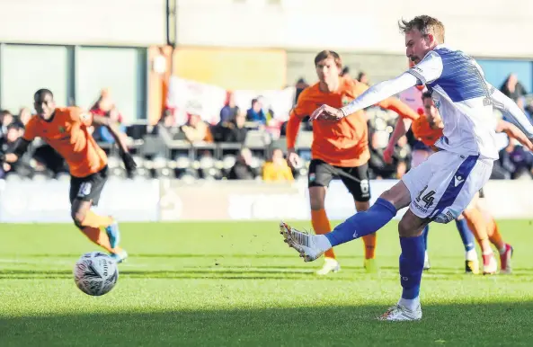  ??  ?? Chris Lines slots home the second-half penalty which earned Bristol Rovers a FA Cup first-round replay against Barnet