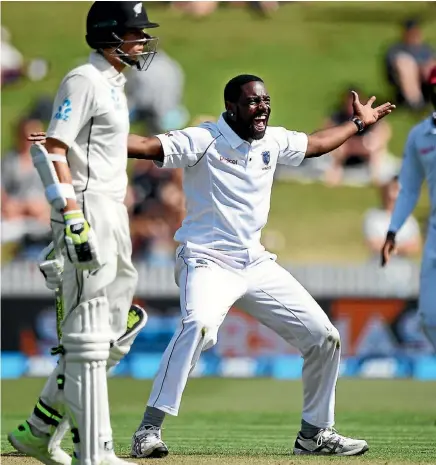  ??  ?? West Indies seamer Raymon Reifer appeals as New Zealand’s Mitchell Santner watches on.