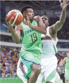  ?? Photo: AP ?? Brazil’s Leandro Barbosa (19) drives around Nigeria’s Ike Diogu (6) during a men’s basketball game at the 2016 Olympic Games in Rio de Janeiro, Brazil on August 15, 2018