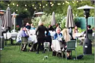  ?? Bryan Haeffele / Hearst Connecticu­t Media ?? Outdoor dining in the garden behind Bernard’s lets customers at the Ridgefield restaurant feel comfortabl­e, co-owner Sarah Bouissou said.