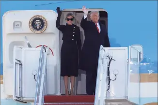  ?? Luis M. Alvarez / Associated Press ?? President Donald Trump and first lady Melania Trump wave to a crowd as they board Air Force One at Andrews Air Force Base, Md., on Wednesday.