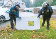  ?? ?? Investigat­ors examine the fuselage plug area of Alaska Airlines Flight 1282 Boeing 737-9 MAX in Portland, Oregon. — Reuters