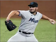  ?? CHRIS O’MEARA
AP PHOTO/ ?? In this Sept. 4, 2020, file photo, Miami Marlins relief pitcher Alex Vesia (96) throws during the fifth inning of a baseball game in St. Petersburg, Fla. Well-traveled right-handed reliever Dylan Floro was traded Dec. 12, 2021, by the Los Angeles Dodgers to the Miami Marlins for left-handed reliever Alex Vesia and pitching prospect Kyle Hurt.