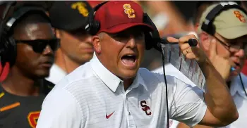  ?? AP PHOTO/MARk J. TERRIll ?? In this 2017 file photo, Southern California head coach Clay Helton yells to his team during the second half of an NCAA college football game against Western Michigan, in Los Angeles.